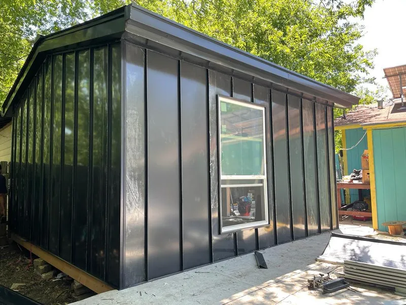 Black standing seam metal wall panels for Roof Inspection in Indianola